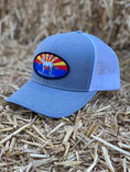 Load image into Gallery viewer, This hat is both well-made and comfortable to wear that features the Arizona flag as the background of our oval patch and a custom stitched Bales quarter horse.