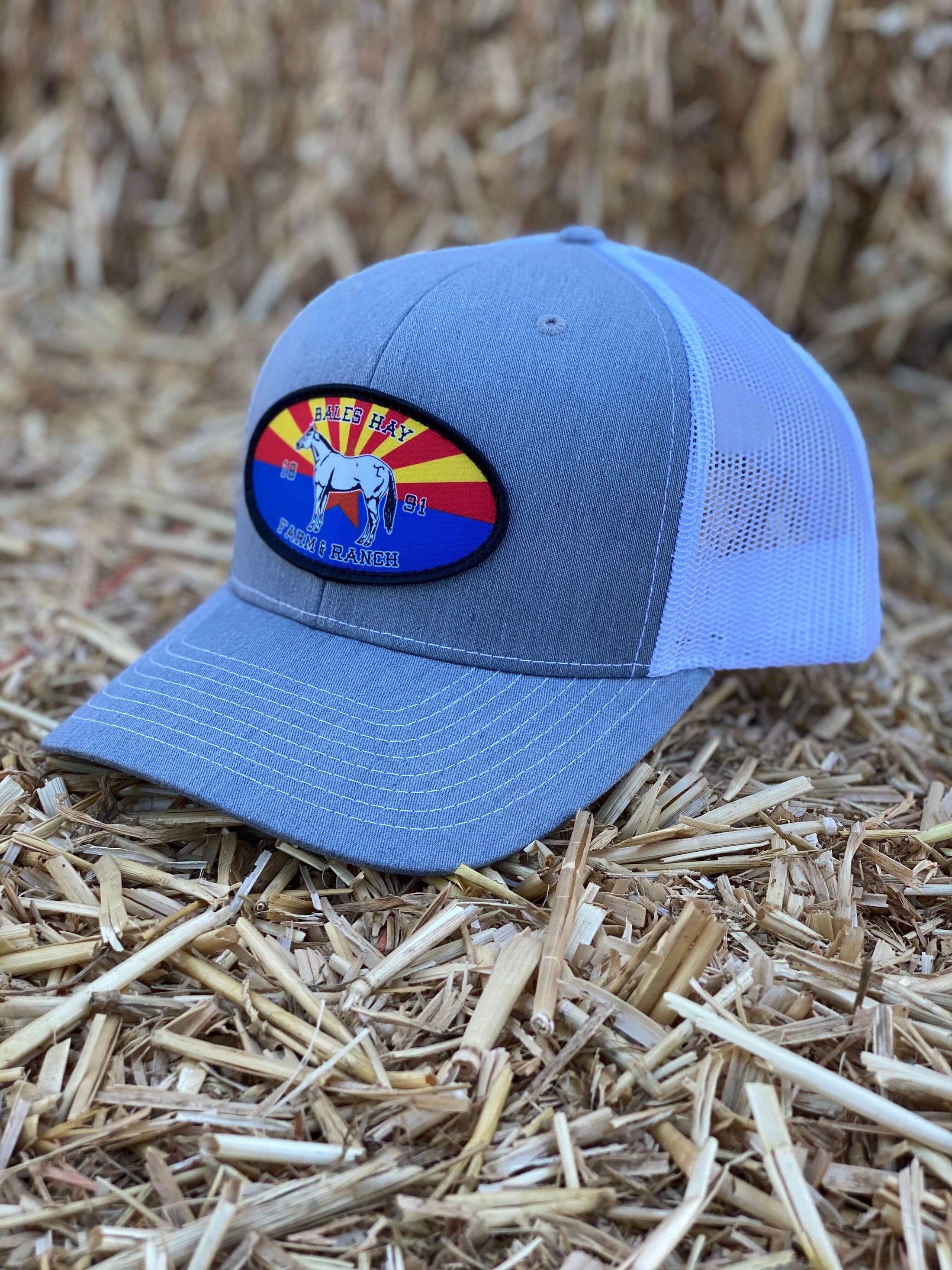 This hat is both well-made and comfortable to wear that features the Arizona flag as the background of our oval patch and a custom stitched Bales quarter horse. 