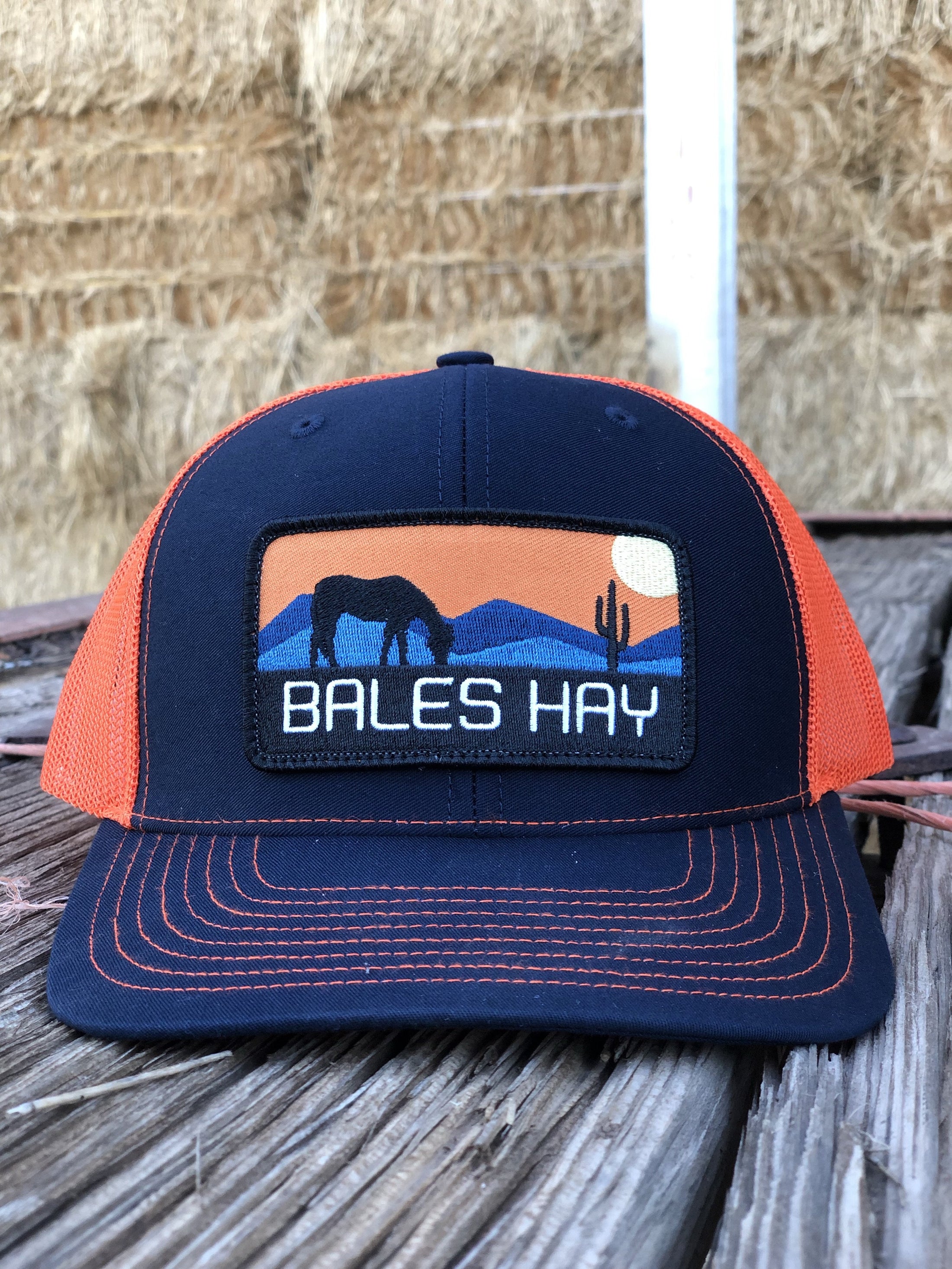This hat is both well-made and comfortable to wear that features the first patch we ever designed! It represents the horses we feed, and the landscape we live in.  